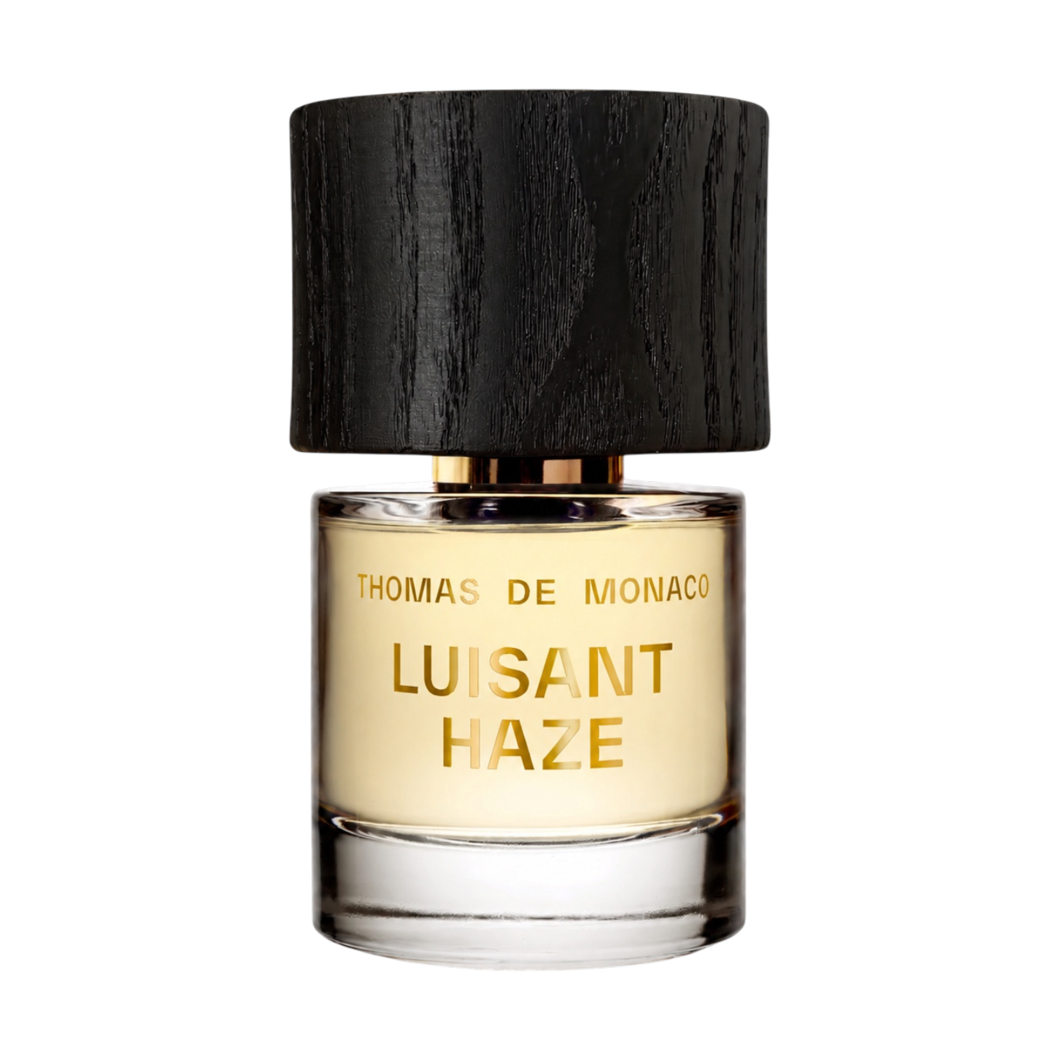 Thomas de Monaco Luisant Haze Extrait de Parfum im klaren Glasflakon mit goldener Beschriftung, hellem Duft und schwarzem Holzverschluss.