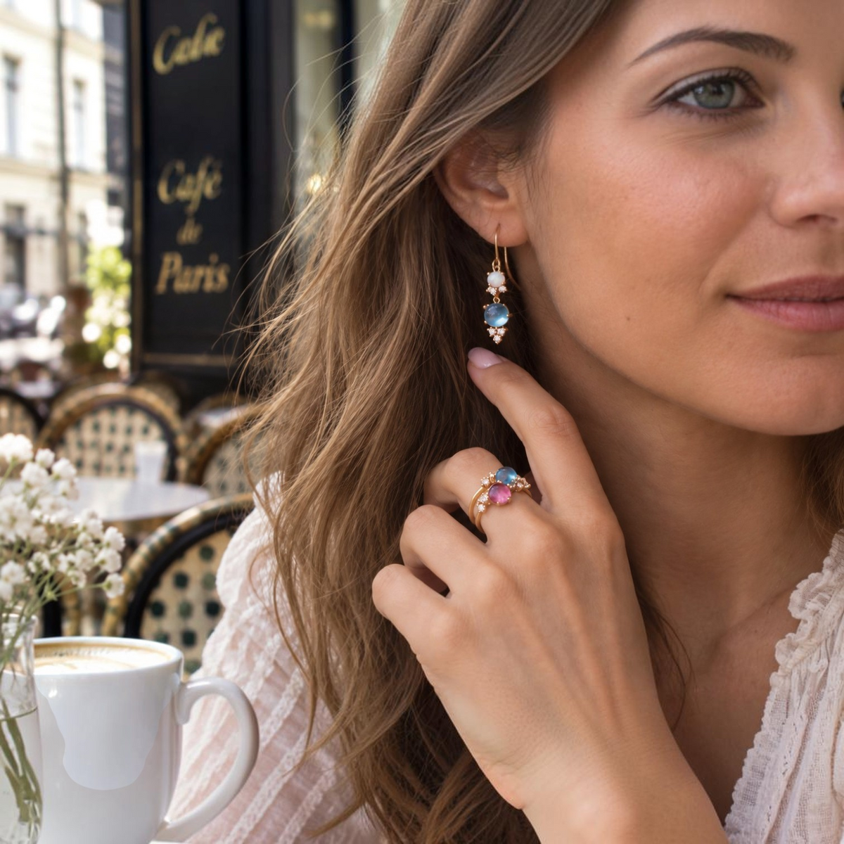 Noën Stellini drop earrings with opal and Swiss Blue Topaz – a jewellery moment in a café