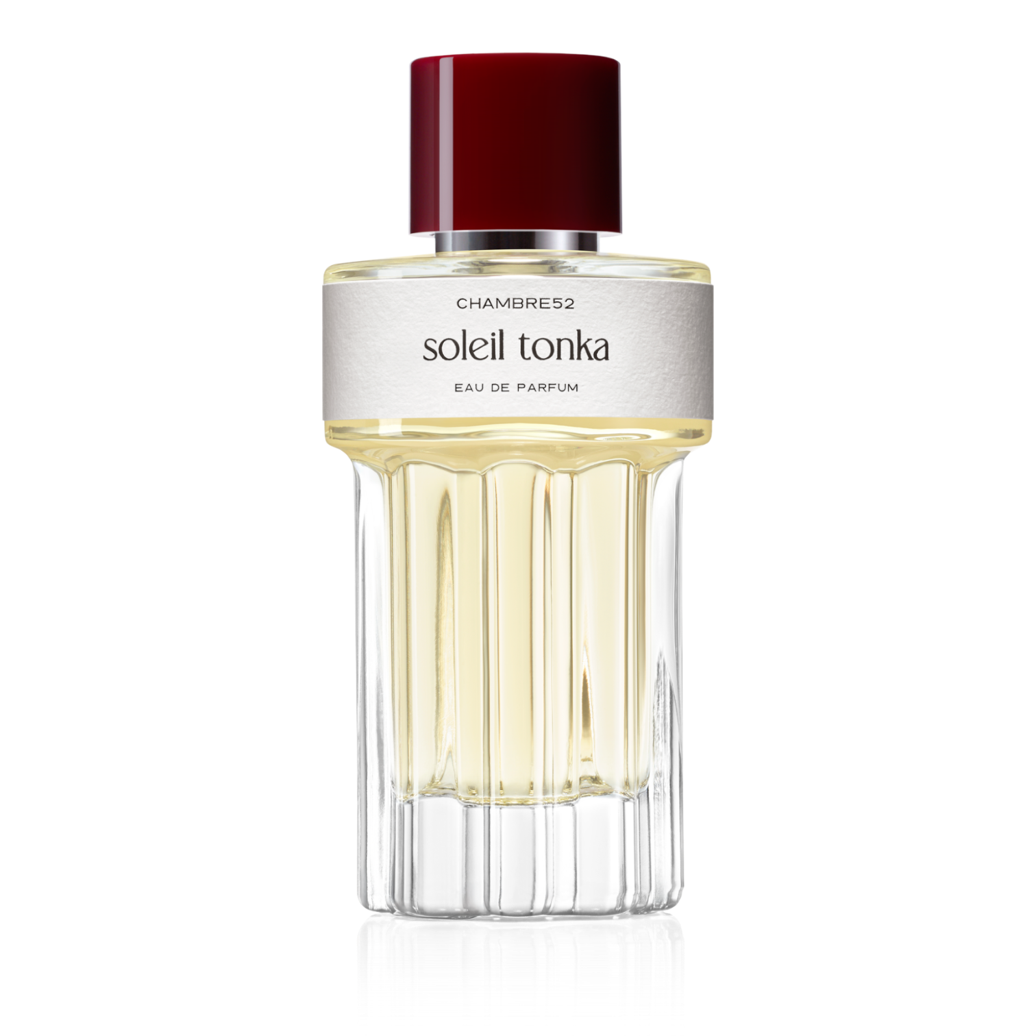 100ml Flakon von Soleil Tonka von Chambre52 – rundes Glasflakon mit bordeauxrotem Verschluss, goldfarbenem Duft und cremeweißem Etikett.